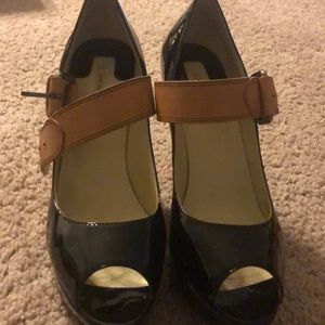 Black patent leather platform shoe.